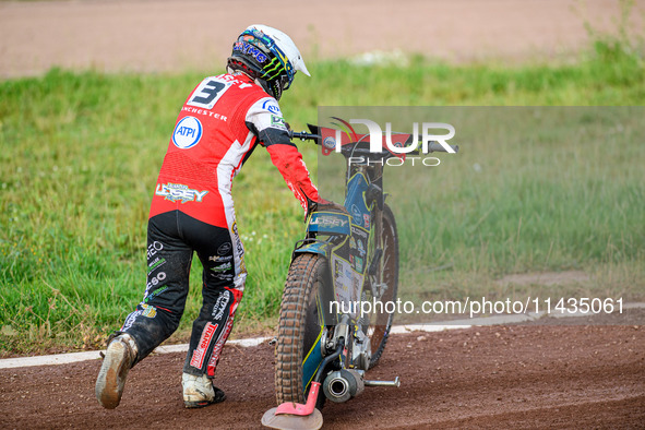 Belle Vue Aces' Jaimon Lidsey is pushing his bike off the track after his fall during the Rowe Motor Oil Premiership match between Leicester...