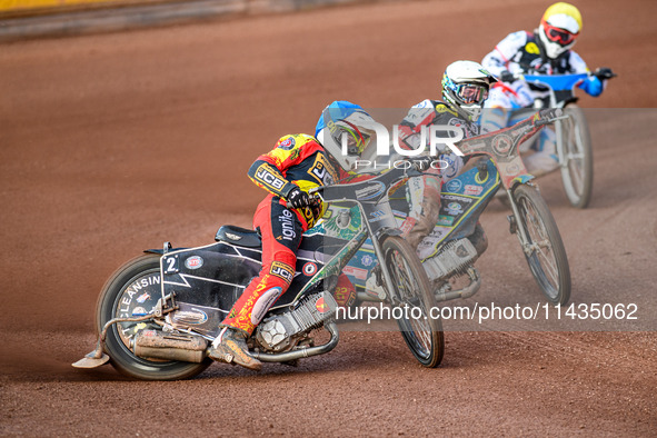 Richard Lawson of Leicester Lions in Blue is leading Jaimon Lidsey of Belle Vue Aces in White and Antti Vuolas of Belle Vue Aces in Yellow d...