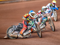 Richard Lawson of Leicester Lions in Blue is leading Jaimon Lidsey of Belle Vue Aces in White and Antti Vuolas of Belle Vue Aces in Yellow d...