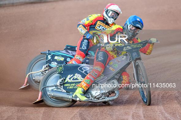 Leicester Lions' Craig Cook in blue is leading teammate Ryan Douglas during the Rowe Motor Oil Premiership match between Leicester Lions and...