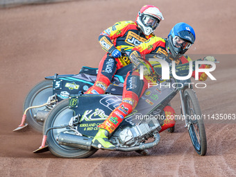 Leicester Lions' Craig Cook in blue is leading teammate Ryan Douglas during the Rowe Motor Oil Premiership match between Leicester Lions and...