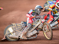 Belle Vue Aces' Norick Blodorn is riding outside Leicester Lions' Richard Lawson during the Rowe Motor Oil Premiership match between Leicest...