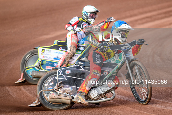 Richard Lawson of Leicester Lions in blue is leading Jaimon Lidsey of Belle Vue Aces in white during the Rowe Motor Oil Premiership match be...