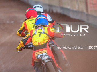 Leicester Lions' Sam Hagon in Blue is chasing Leicester Lions' Richard Lawson in Red and Belle Vue Aces' Norick Blodorn in White during the...