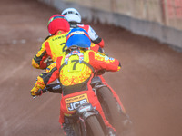 Leicester Lions' Sam Hagon in Blue is chasing Leicester Lions' Richard Lawson in Red and Belle Vue Aces' Norick Blodorn in White during the...