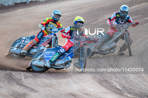 Belle Vue Aces' Brady Kurtz in Yellow is leading Leicester Lions' Luke Becker in Blue and Belle Vue Aces' Norick Blodorn in White during the...