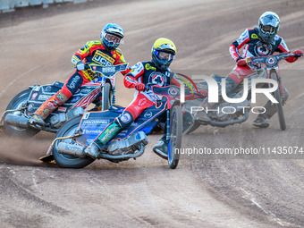 Belle Vue Aces' Brady Kurtz in Yellow is leading Leicester Lions' Luke Becker in Blue and Belle Vue Aces' Norick Blodorn in White during the...