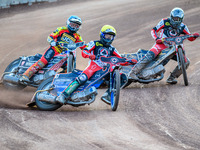 Belle Vue Aces' Brady Kurtz in Yellow is leading Leicester Lions' Luke Becker in Blue and Belle Vue Aces' Norick Blodorn in White during the...