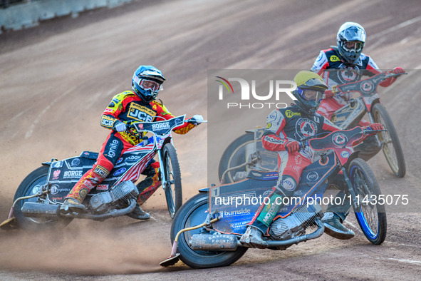 Belle Vue Aces' Brady Kurtz in Yellow is leading Leicester Lions' Luke Becker in Blue and Belle Vue Aces' Norick Blodorn in White during the...