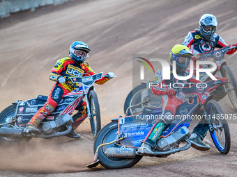 Belle Vue Aces' Brady Kurtz in Yellow is leading Leicester Lions' Luke Becker in Blue and Belle Vue Aces' Norick Blodorn in White during the...