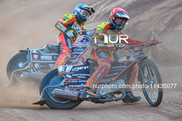 Leicester Lions' Sam Masters in red is leading teammate Luke Becker during the Rowe Motor Oil Premiership match between Leicester Lions and...