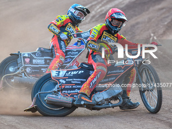 Leicester Lions' Sam Masters in red is leading teammate Luke Becker during the Rowe Motor Oil Premiership match between Leicester Lions and...