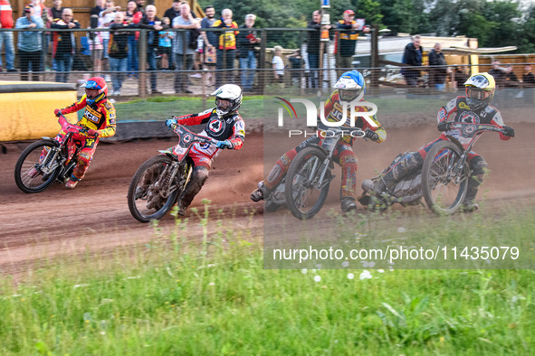 Belle Vue Aces' Jaimon Lidsey in White is leading Leicester Lions' Max Fricke in Red, Leicester Lions' Richard Lawson in Blue, and Belle Vue...