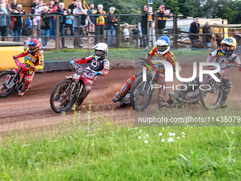 Belle Vue Aces' Jaimon Lidsey in White is leading Leicester Lions' Max Fricke in Red, Leicester Lions' Richard Lawson in Blue, and Belle Vue...