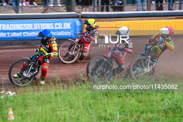 Leicester Lions' Craig Cook in Blue is leading Belle Vue Aces' Brady Kurtz in White, Belle Vue Aces' Ben Cook in Yellow, and Leicester Lions...