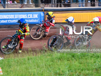 Leicester Lions' Craig Cook in Blue is leading Belle Vue Aces' Brady Kurtz in White, Belle Vue Aces' Ben Cook in Yellow, and Leicester Lions...