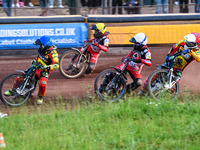 Leicester Lions' Craig Cook in Blue is leading Belle Vue Aces' Brady Kurtz in White, Belle Vue Aces' Ben Cook in Yellow, and Leicester Lions...