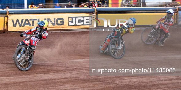 Belle Vue Aces' Ben Cook in Yellow is leading Leicester Lions' Ryan Douglas in Blue as Belle Vue Aces' Brady Kurtz in White is picking up so...