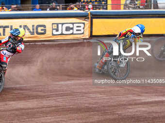 Belle Vue Aces' Ben Cook in Yellow is leading Leicester Lions' Ryan Douglas in Blue as Belle Vue Aces' Brady Kurtz in White is picking up so...