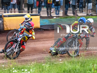 Leicester Lions' Luke Becker in Red is leading Leicester Lions' Craig Cook in Blue with Leicester Lions' Sam Hagon in Yellow on the outside...