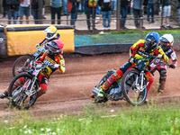 Leicester Lions' Luke Becker in Red is leading Leicester Lions' Craig Cook in Blue with Leicester Lions' Sam Hagon in Yellow on the outside...