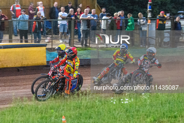 Leicester Lions' Sam Masters in Red is riding inside Belle Vue Aces' Brady Kurtz in Yellow with Belle Vue Aces' Ben Cook in White and Leices...