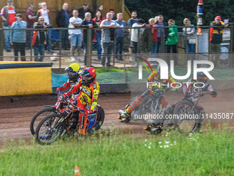 Leicester Lions' Sam Masters in Red is riding inside Belle Vue Aces' Brady Kurtz in Yellow with Belle Vue Aces' Ben Cook in White and Leices...