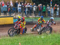 Leicester Lions' Sam Masters in Red is riding inside Belle Vue Aces' Brady Kurtz in Yellow with Belle Vue Aces' Ben Cook in White and Leices...