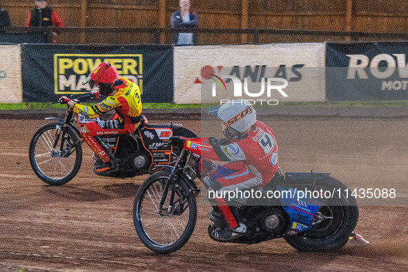 Belle Vue Aces' Ben Cook in white is chasing Leicester Lions' Sam Masters in red during the Rowe Motor Oil Premiership match between Leicest...