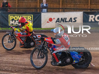 Belle Vue Aces' Ben Cook in white is chasing Leicester Lions' Sam Masters in red during the Rowe Motor Oil Premiership match between Leicest...