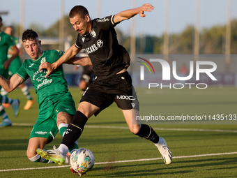 Joao Mendes (right) of Vitoria SC is being challenged by Alejandro Garzia (left) of Floriana during the UEFA Europa Conference League, Secon...