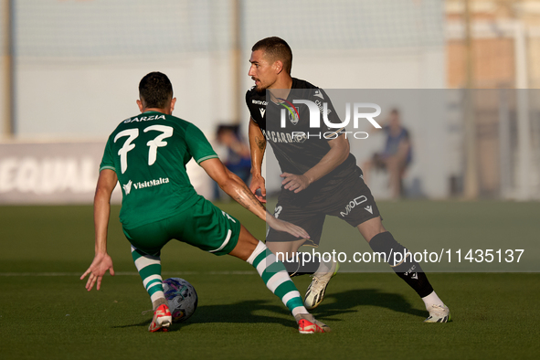 Joao Mendes (right) of Vitoria SC is being confronted by Alejandro Garzia (left) of Floriana during the UEFA Europa Conference League, Secon...