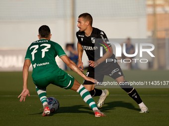 Joao Mendes (right) of Vitoria SC is being confronted by Alejandro Garzia (left) of Floriana during the UEFA Europa Conference League, Secon...