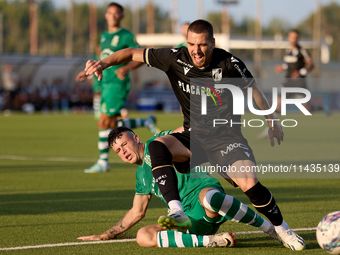 Joao Mendes (right) of Vitoria SC is being challenged by Alejandro Garzia (left) of Floriana during the UEFA Europa Conference League, Secon...