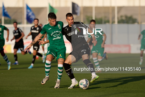 Joao Mendes (right) of Vitoria SC is being challenged by Alejandro Garzia (left) of Floriana during the UEFA Europa Conference League, Secon...