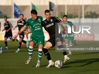 Joao Mendes (right) of Vitoria SC is being challenged by Alejandro Garzia (left) of Floriana during the UEFA Europa Conference League, Secon...