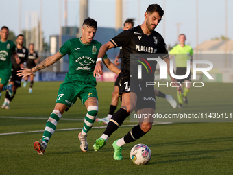 Nelson Oliveira (R) of Vitoria SC is being closely followed by Alejandro Garzia (L) of Floriana during the UEFA Europa Conference League, Se...