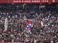 Supporters of Ajax are cheering during the match Ajax vs. Vojvodina at the Johan Cruijff ArenA for the UEFA Europa League Second qualifying...