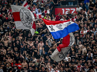 Supporters of Ajax are cheering during the match Ajax vs. Vojvodina at the Johan Cruijff ArenA for the UEFA Europa League Second qualifying...