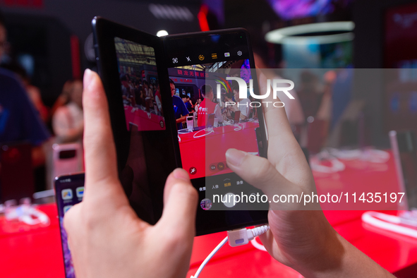 A fairgoer is trying out the Samsung Z Fold6 during the Chinajoy games fair in Shanghai, China, on July 26, 2024. 