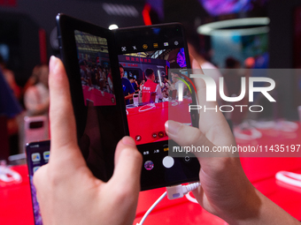 A fairgoer is trying out the Samsung Z Fold6 during the Chinajoy games fair in Shanghai, China, on July 26, 2024. (