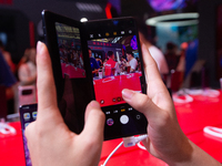 A fairgoer is trying out the Samsung Z Fold6 during the Chinajoy games fair in Shanghai, China, on July 26, 2024. (