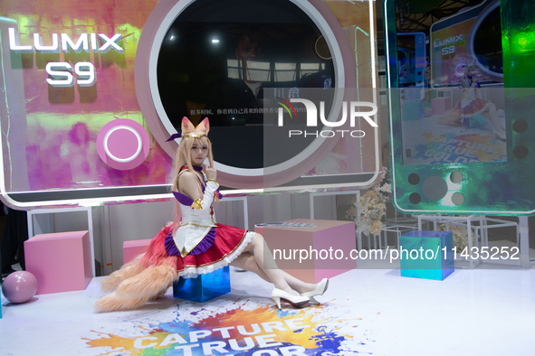 A model is being seen at the Fuji Lumix S9 booth during the Chinajoy games fair in Shanghai, China, on July 26, 2024. 