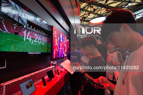 Fairgoers are visiting the Snapdragon semiconductor booth during the Chinajoy games fair in Shanghai, China, on July 26, 2024. 