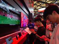 Fairgoers are visiting the Snapdragon semiconductor booth during the Chinajoy games fair in Shanghai, China, on July 26, 2024. (