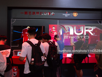 Fairgoers are visiting the Snapdragon semiconductor booth during the Chinajoy games fair in Shanghai, China, on July 26, 2024. (