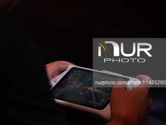 A fairgoer is playing games during the Chinajoy games fair in Shanghai, China, on July 26, 2024. (