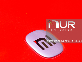 A general view of the Xiaomi logo is being seen from a car during the Chinajoy games fair in Shanghai, China, on July 26, 2024. (