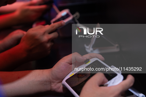 Fairgoers are playing games during the Chinajoy games fair in Shanghai, China, on July 26, 2024. 