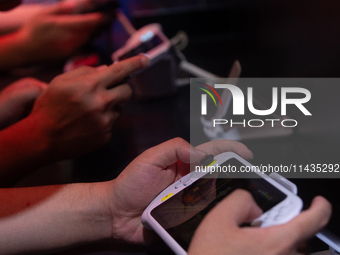 Fairgoers are playing games during the Chinajoy games fair in Shanghai, China, on July 26, 2024. (